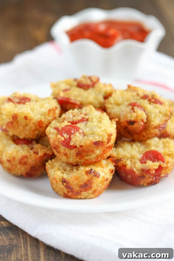Several mini quinoa pizzas artfully arranged on a white plate, ready to be served.