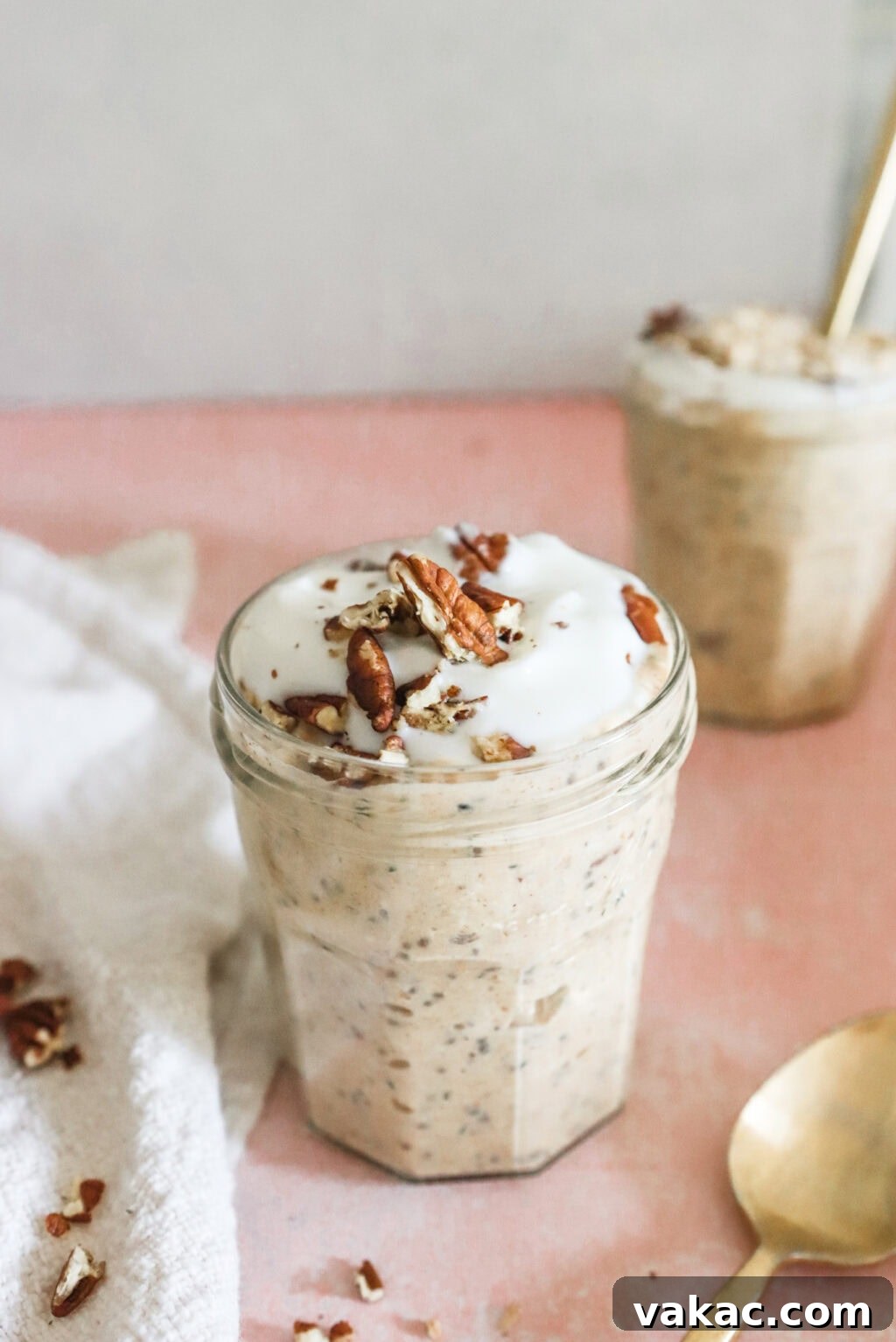 Effortless Autumn Bliss: Pumpkin Pie Spice Overnight Oats 2 Easy & Filling Pumpkin Pie Spice Overnight Oats in glass jars on a pink counter