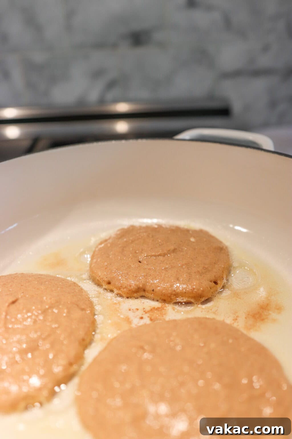 Power-Packed Pumpkin Cottage Cheese Pancakes 6 Three High Protein Pumpkin Pancakes with Cottage Cheese in a white pan