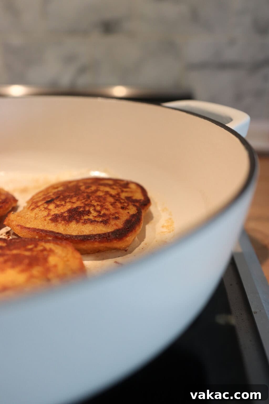 Power-Packed Pumpkin Cottage Cheese Pancakes 7 Three High Protein Pumpkin Pancakes with Cottage Cheese in a white pan