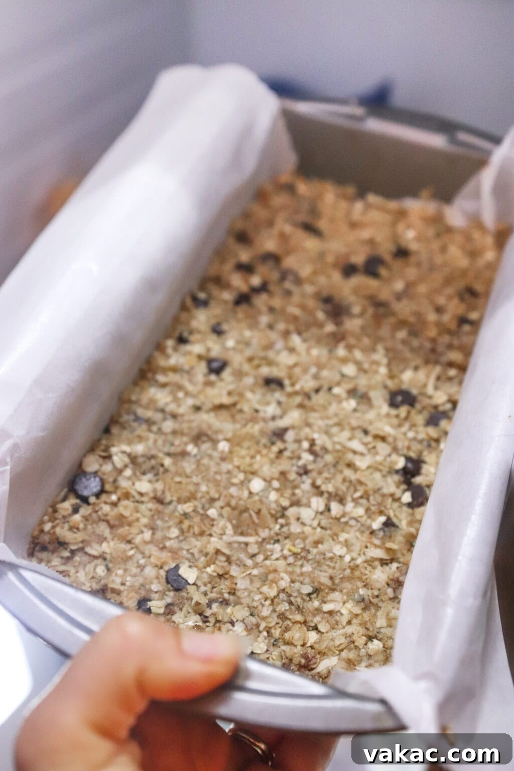 Homemade Heavenly Hunks: So Good, You'll Never Buy Them Again 5 The Heavenly Hunks mixture pressed evenly into a parchment paper-lined baking pan, ready for chilling
