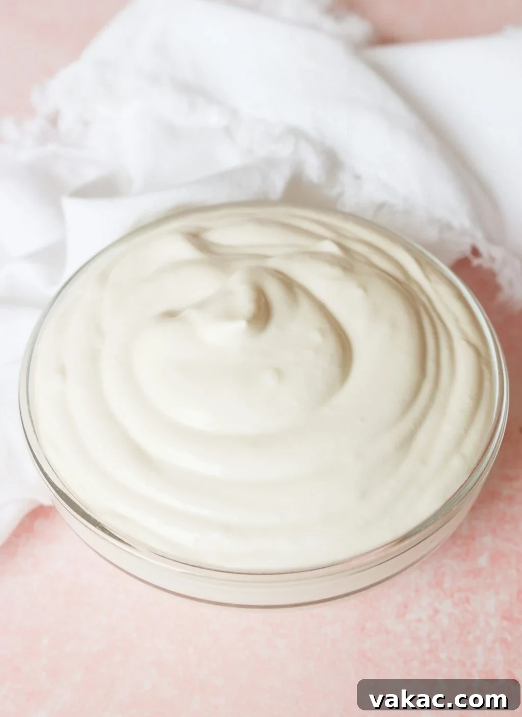 Greek Yogurt Whip: The Speedy, Guilt-Free Dessert Topping 5 A hand mixer actively whipping the Greek yogurt, cream, vanilla extract, and sweetener mixture in a stainless steel bowl, creating a light and fluffy texture.