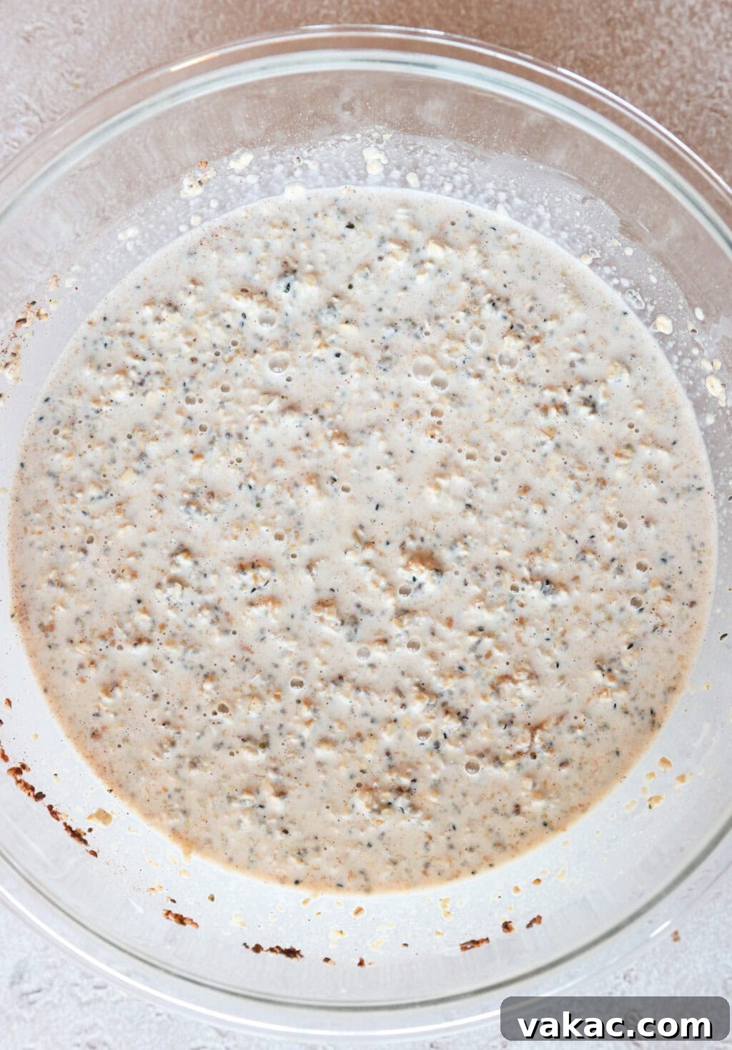 Effortless Tiramisu Overnight Oats with Greek Yogurt 4 The overnight oats mixture sitting in a glass bowl, ready to be portioned into containers.