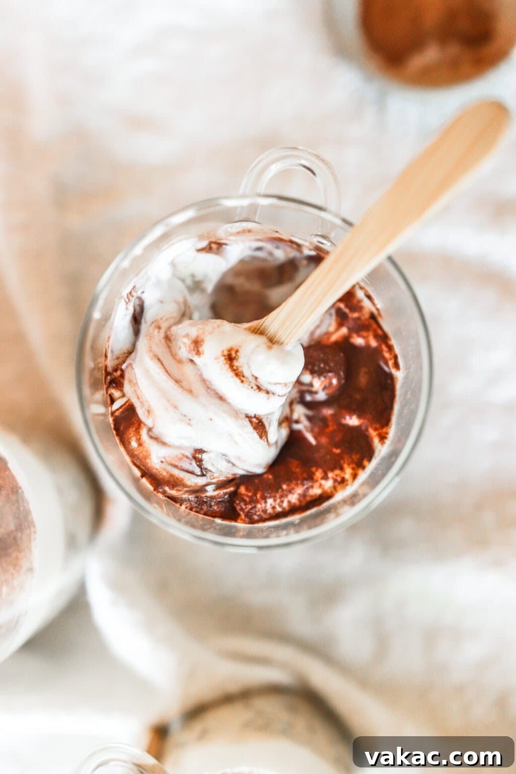 Effortless Tiramisu Overnight Oats with Greek Yogurt 6 Close-up of finished Tiramisu Overnight Oats in a glass jar with a wooden spoon, highlighting the rich layers.