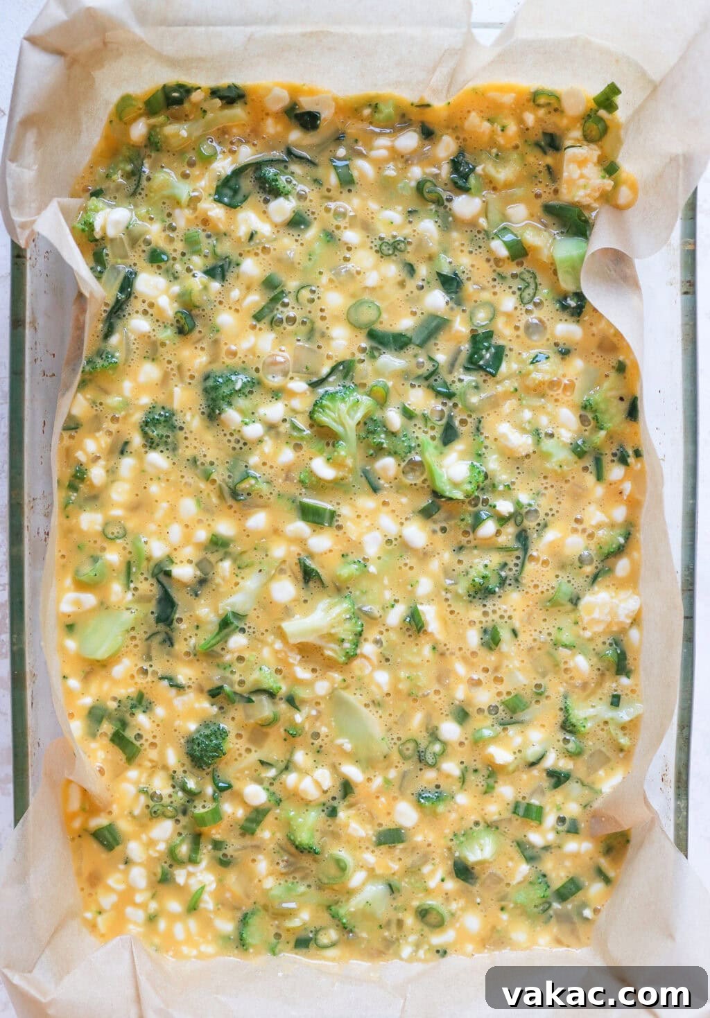 Hearty Protein Egg and Cottage Cheese Bake 7 The combined ingredients for the Egg and Cottage Cheese Breakfast Bake poured into a glass baking dish, ready to go into the oven.