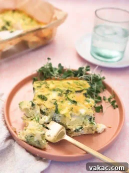Hearty Protein Egg and Cottage Cheese Bake 10 The finished High-Protein Egg and Cottage Cheese Breakfast Bake, sliced and served on a pink plate.