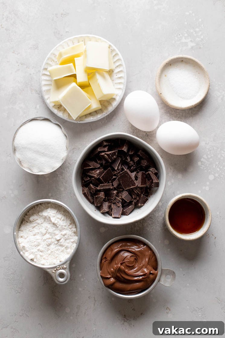 An overhead view of the ingredients needed to make homemade brownies with Nutella. 