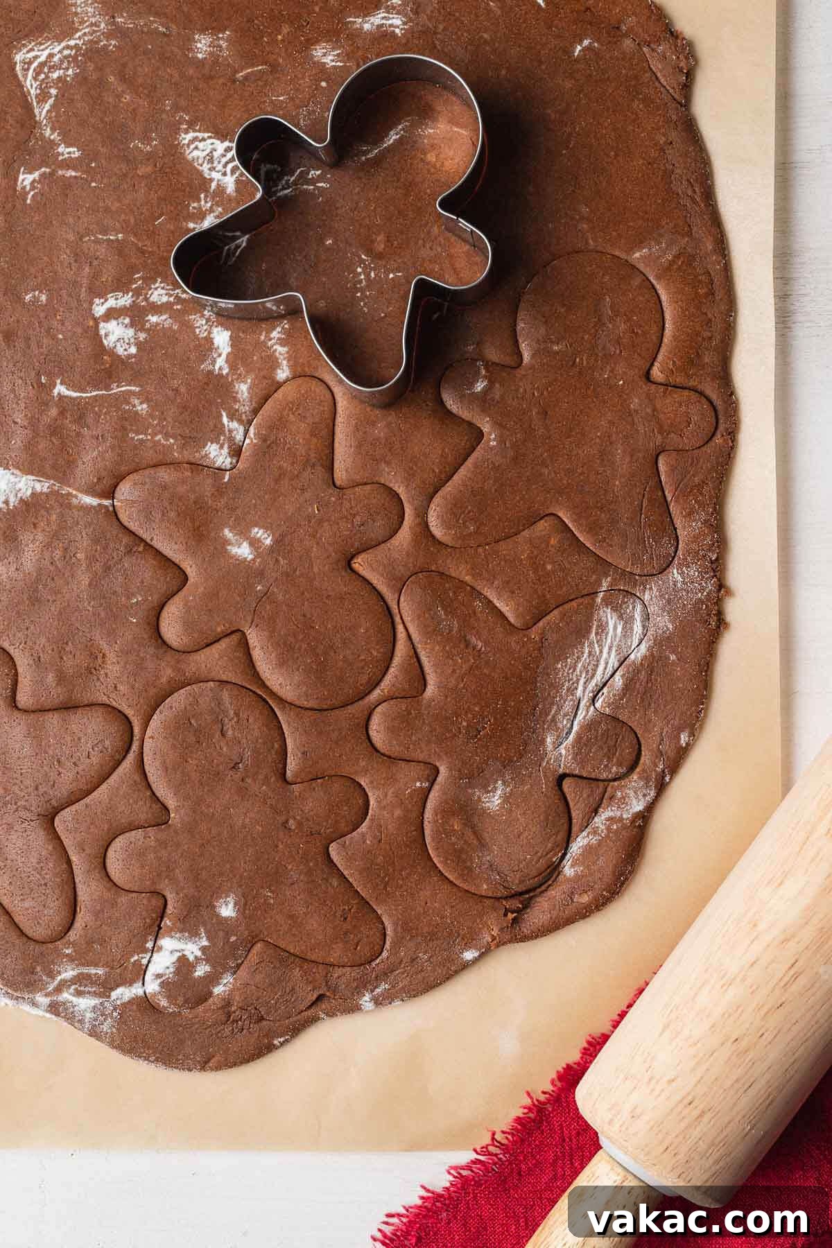 Irresistibly Soft Gingerbread 4 An overhead view of gingerbread cookie dough being cut out with a cookie cutter.