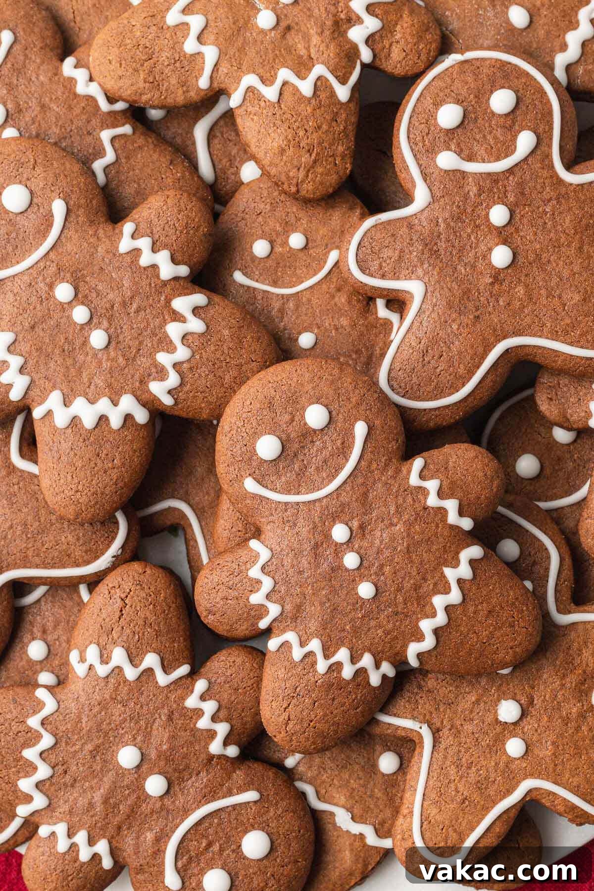 Irresistibly Soft Gingerbread 7 A close up, overhead view of a pile of gingerbread cutout cookies.