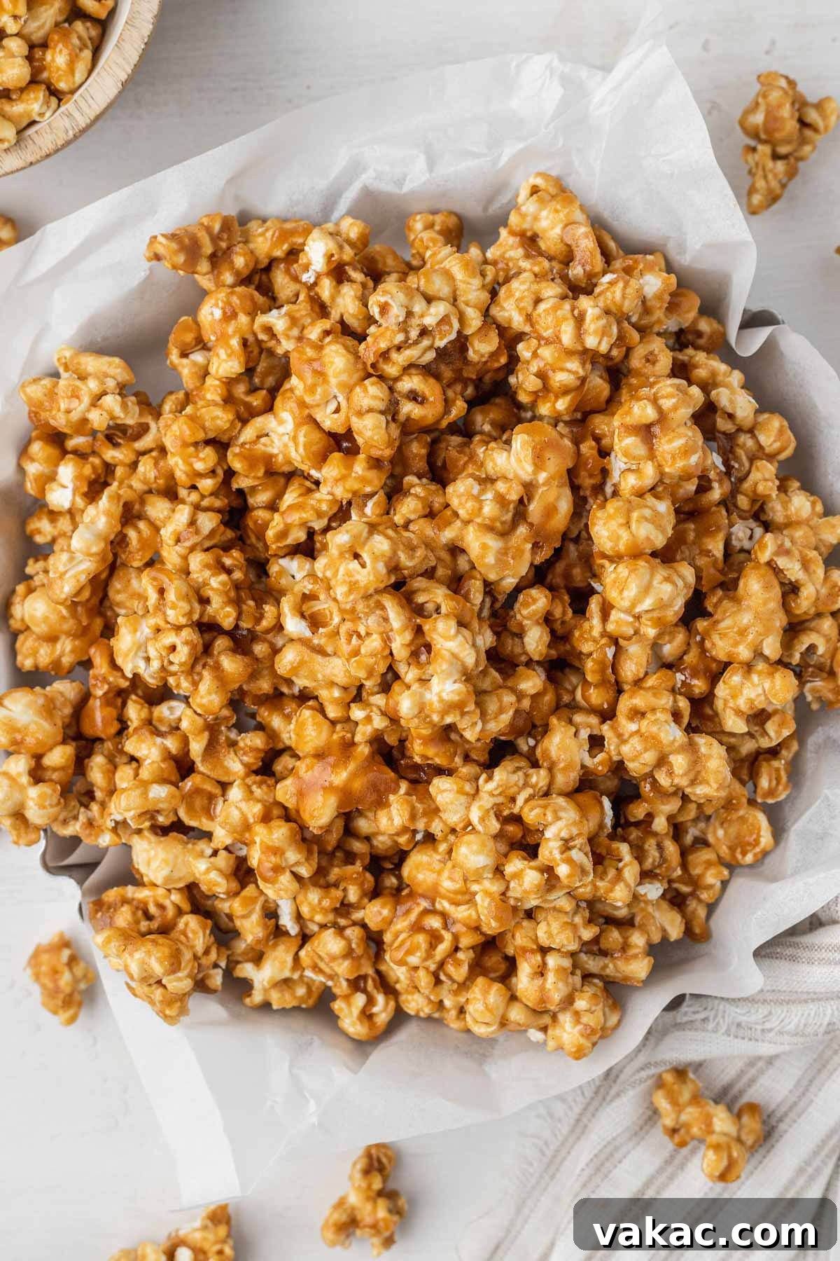 Golden Caramel Popcorn 7 An overhead view of baked caramel corn in a metal tart pan.