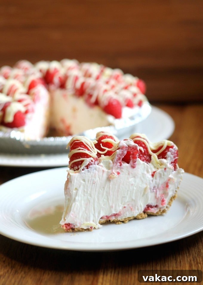 Over 20 No-Bake Treats to Beat the Summer Heat 8 Raspberry White Chocolate Cheesecake Pie, a decadent no-bake dessert featuring fruit and chocolate