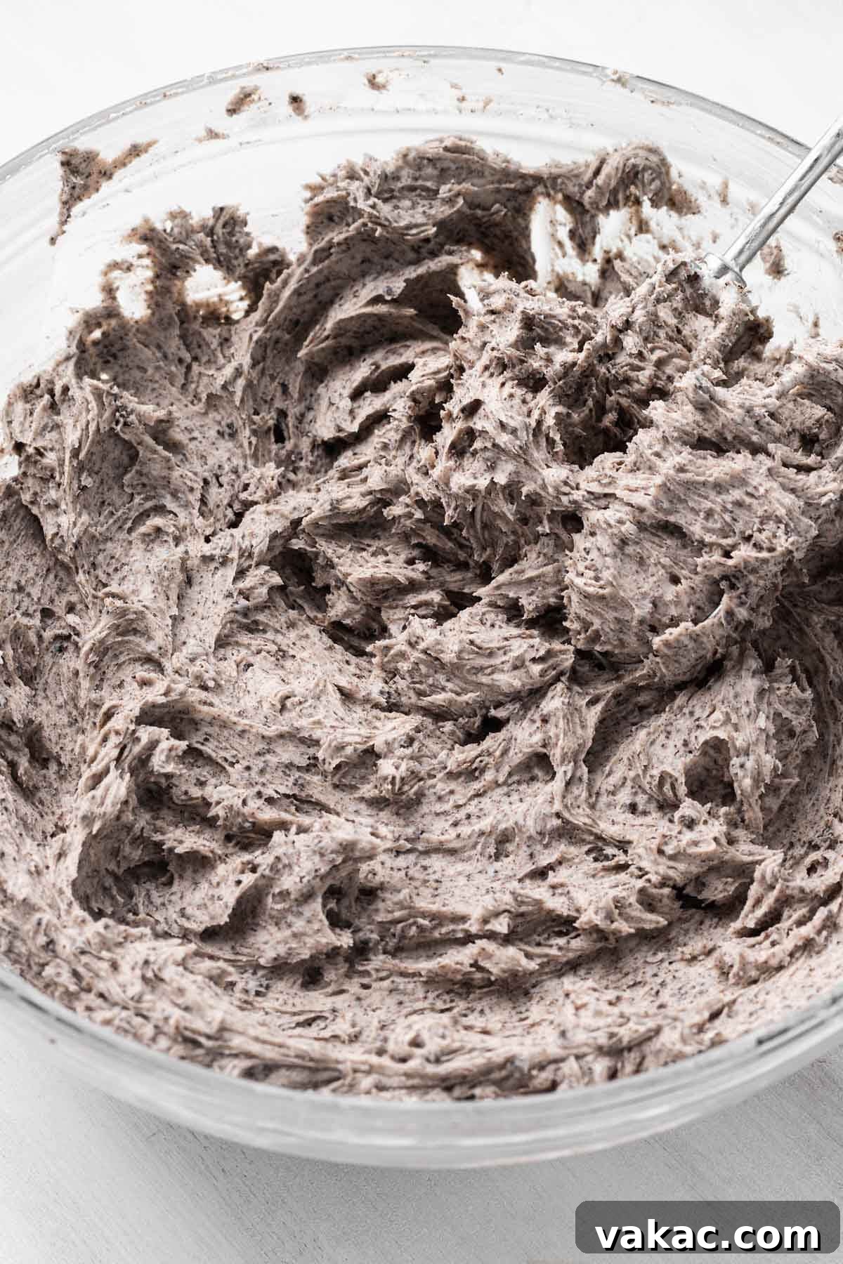 Cookies and Cream Dream Cake 4 Oreo buttercream frosting in a glass mixing bowl.