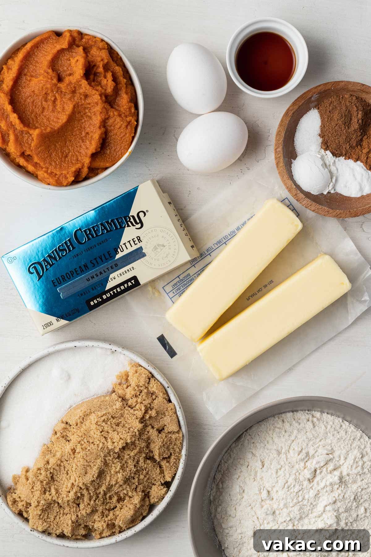 Autumn Spiced Pumpkin Bars 4 Overhead shot showcasing all the essential ingredients laid out for making delicious pumpkin spice bars, ready for baking.