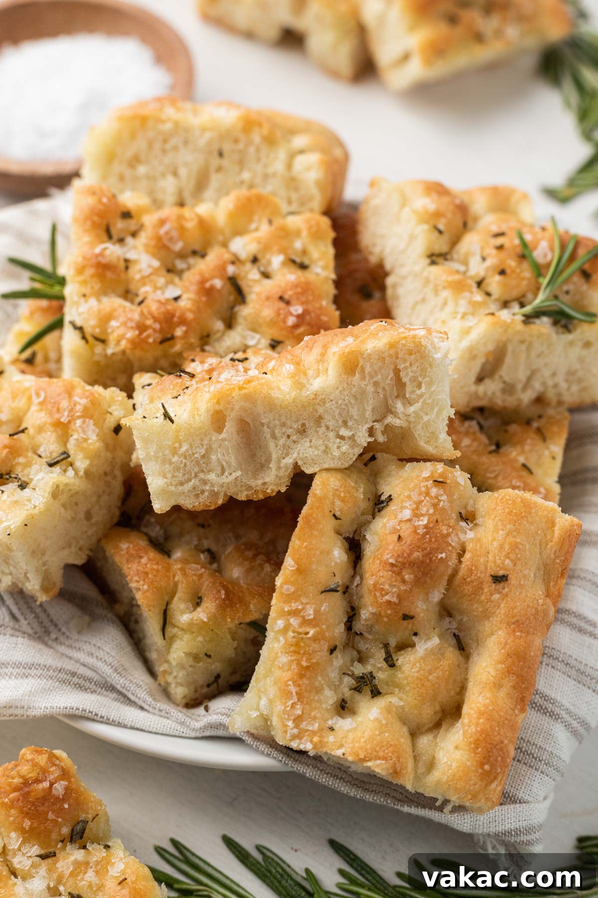 Pillowy Focaccia Perfection 7 Focaccia slices piled high on a plate.