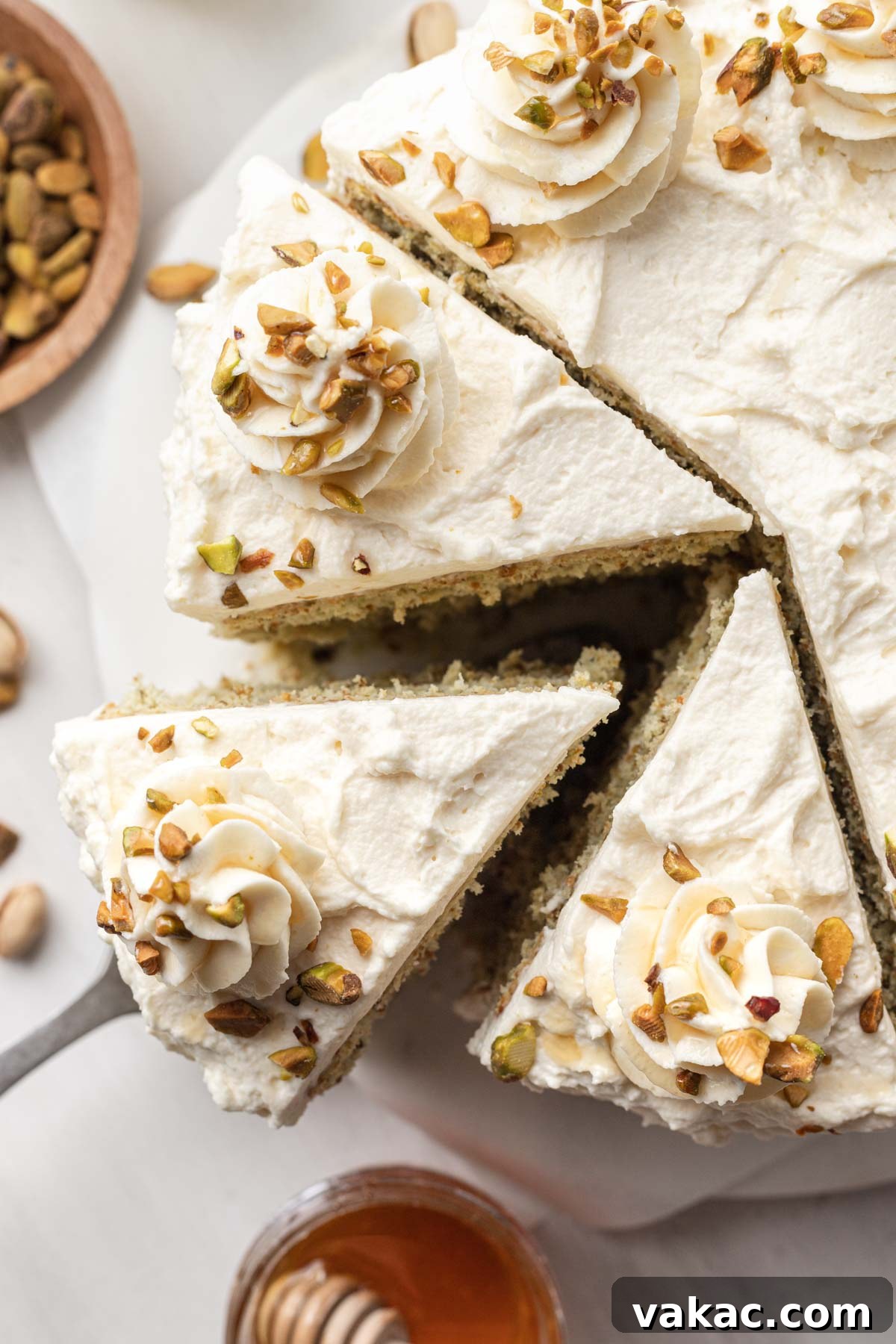 Velvet Pistachio Indulgence 4 An overhead view of a sliced pistachio layer cake.
