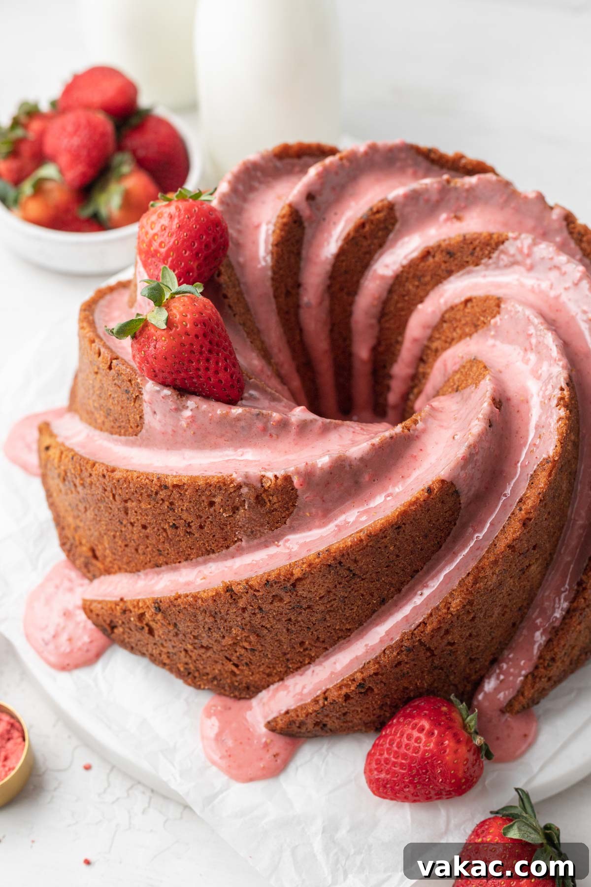 Strawberry Butter Cake 2 A glazed strawberry pound cake, garnished with fresh berries.