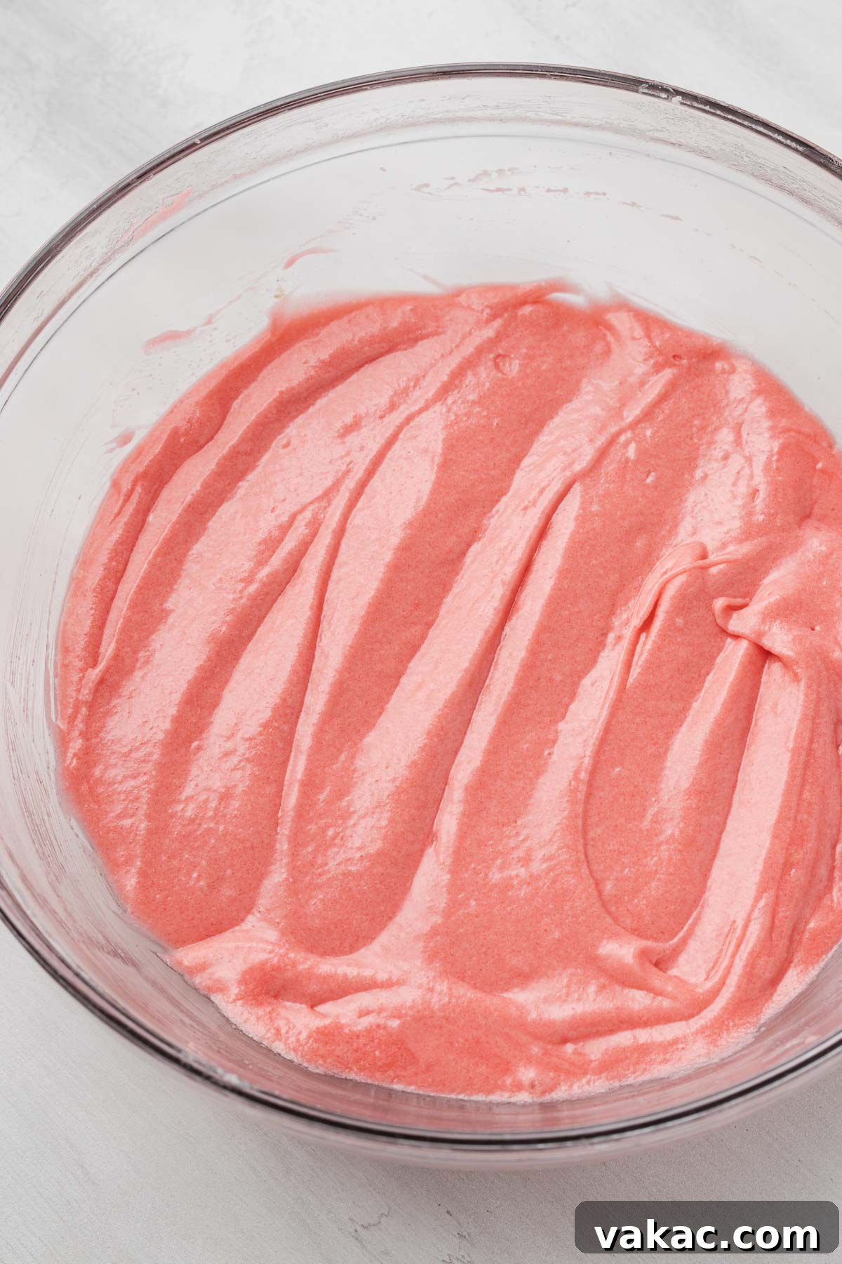 Strawberry Butter Cake 4 An overhead view of the wet ingredients mixed together for strawberry pound cake.