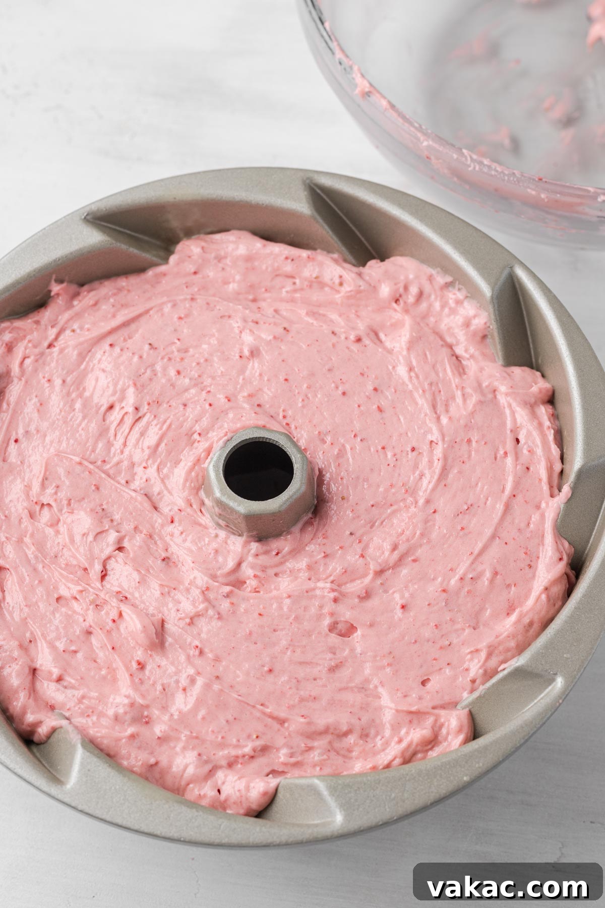 Strawberry Butter Cake 6 Strawberry pound cake batter in a metal bundt pan.