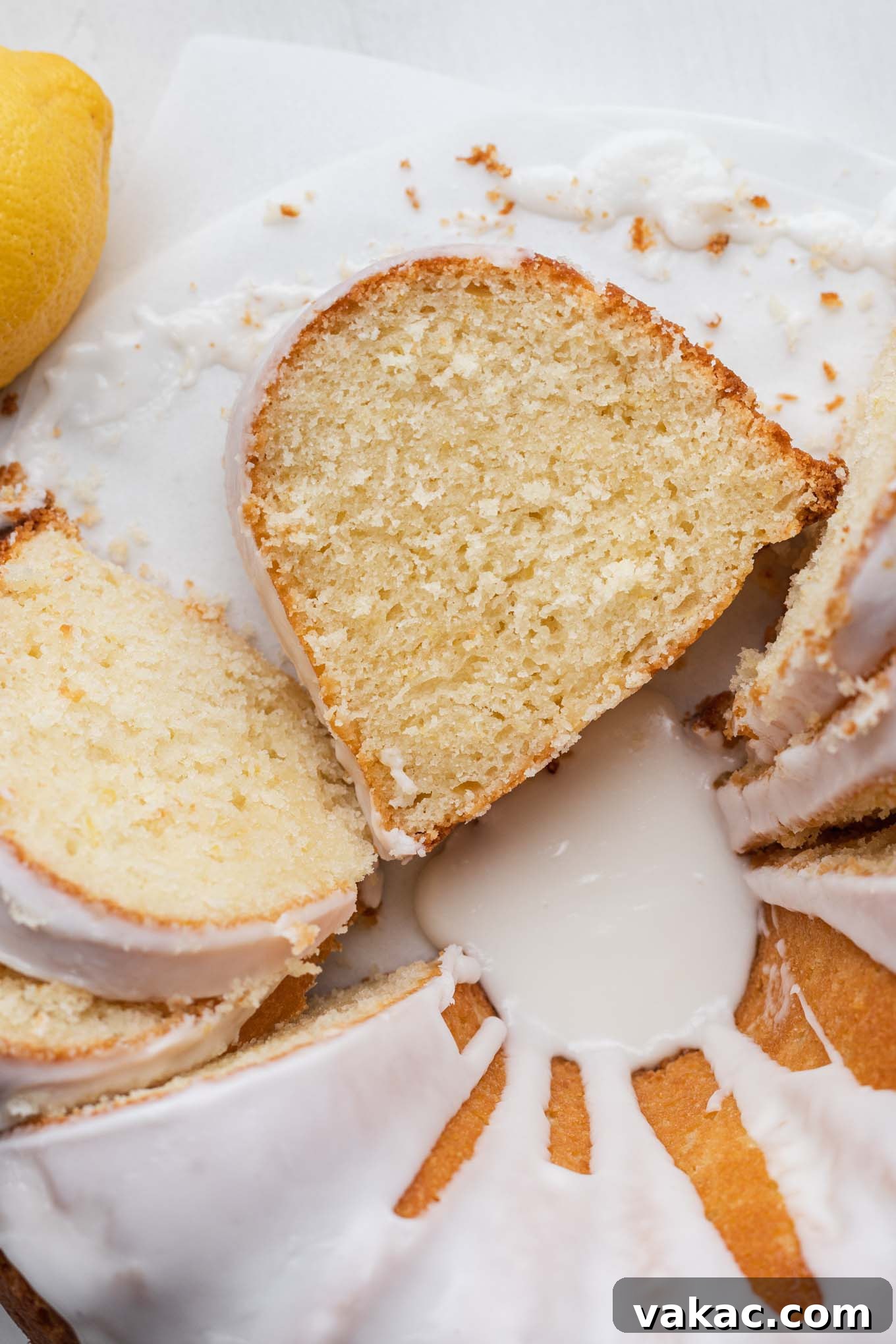 Sunshine Lemon Pound Cake 9 A close up, overhead view of a sliced lemon sour cream pound cake.