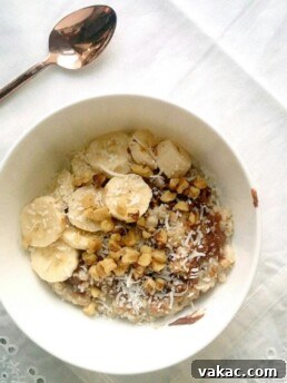 Delicious Chocolate Peanut Butter Oatmeal with Coconut, Walnuts and Banana topping