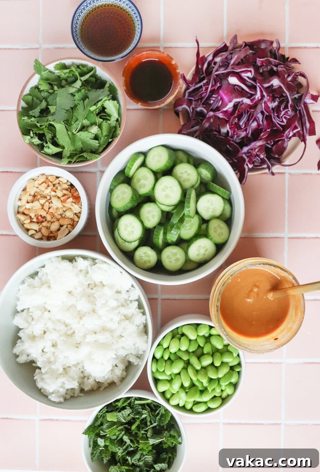 All the fresh ingredients for a Thai Crispy Rice Salad arranged in small bowls, ready for preparation.