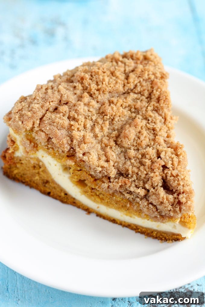 Finished Pumpkin Cream Cheese Crumb Cake cooling on a wire rack after baking
