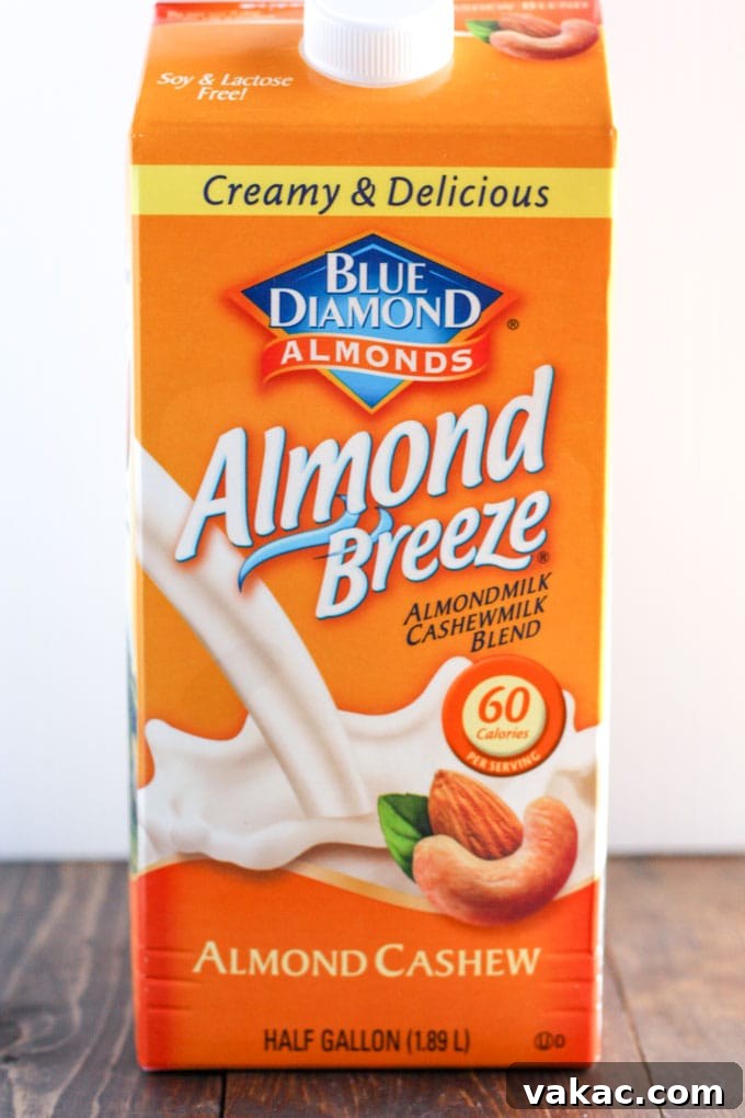 Cozy Gingerbread Pancakes 4 A carton of Blue Diamond Almond Breeze Almondmilk & Cashewmilk Blend, illustrating the type of milk used in the recipe, neatly placed to highlight a key ingredient.
