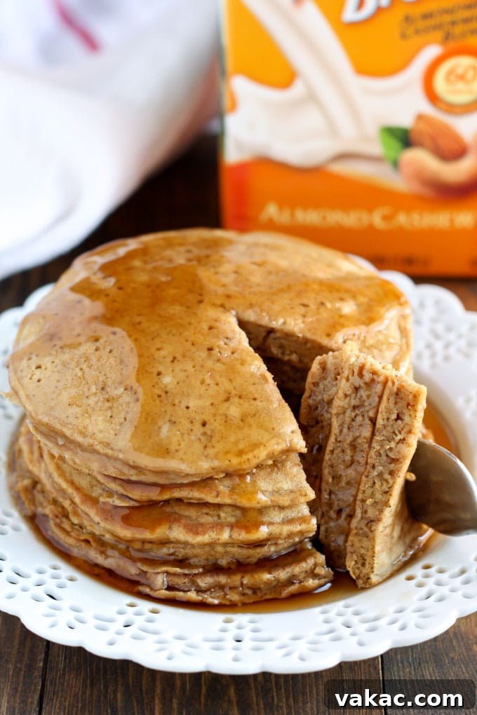 Cozy Gingerbread Pancakes 6 A stack of delicious gingerbread pancakes ready to be served, highlighting their inviting texture and festive appeal.