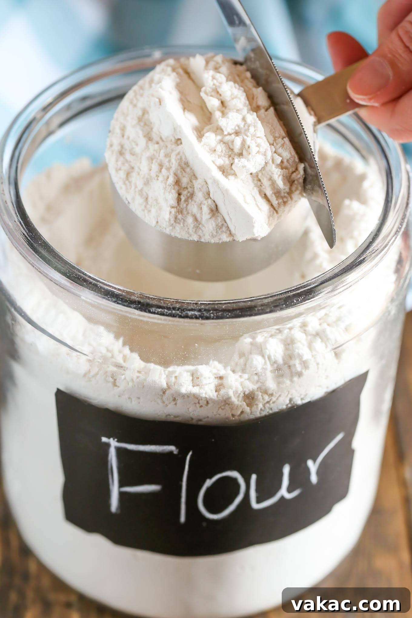 Spoon flour gently into the measuring cup until slightly overflowing
