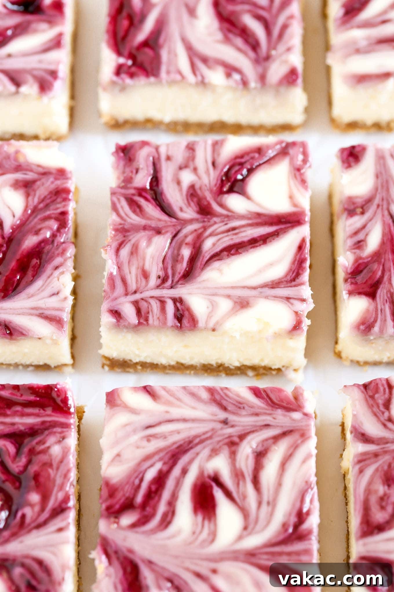 A homemade graham cracker crust topped with a smooth and creamy cheesecake filling and blackberry swirl. These Blackberry Swirl Cheesecake Bars make a gorgeous and delicious dessert!