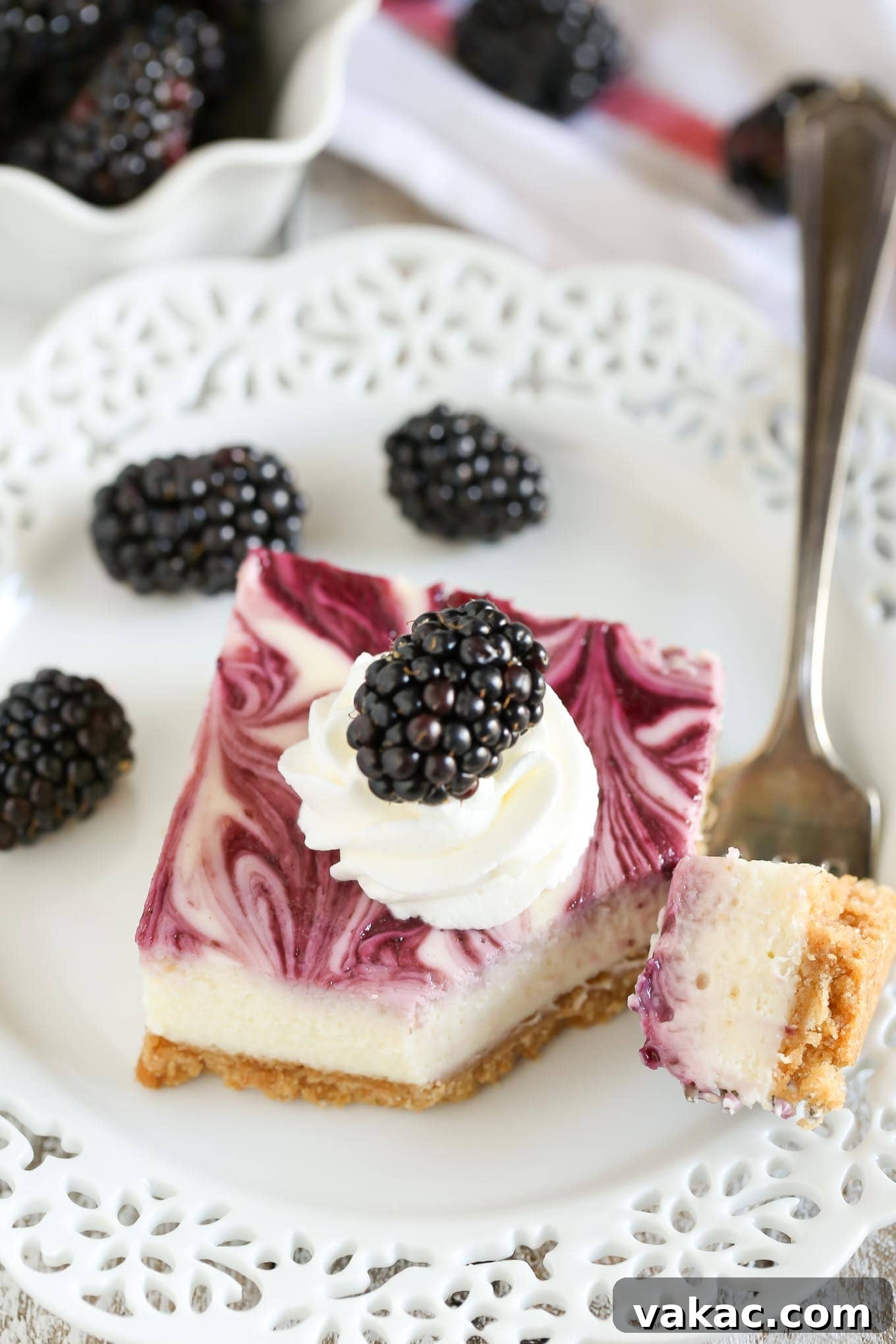 A homemade graham cracker crust topped with a smooth and creamy cheesecake filling and blackberry swirl. These Blackberry Swirl Cheesecake Bars make a gorgeous and delicious dessert!