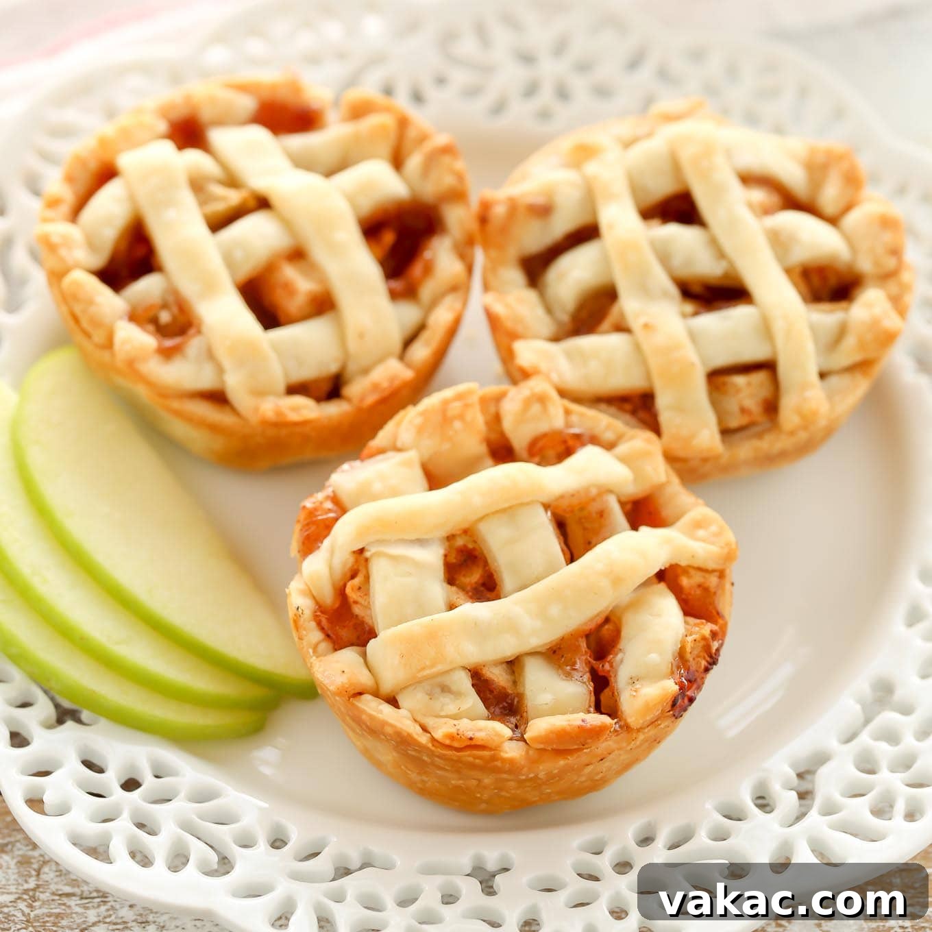 Tiny Pecan Treasures 6 Platter of adorable mini apple pies, their lattice tops perfectly browned, ideal for fall desserts.