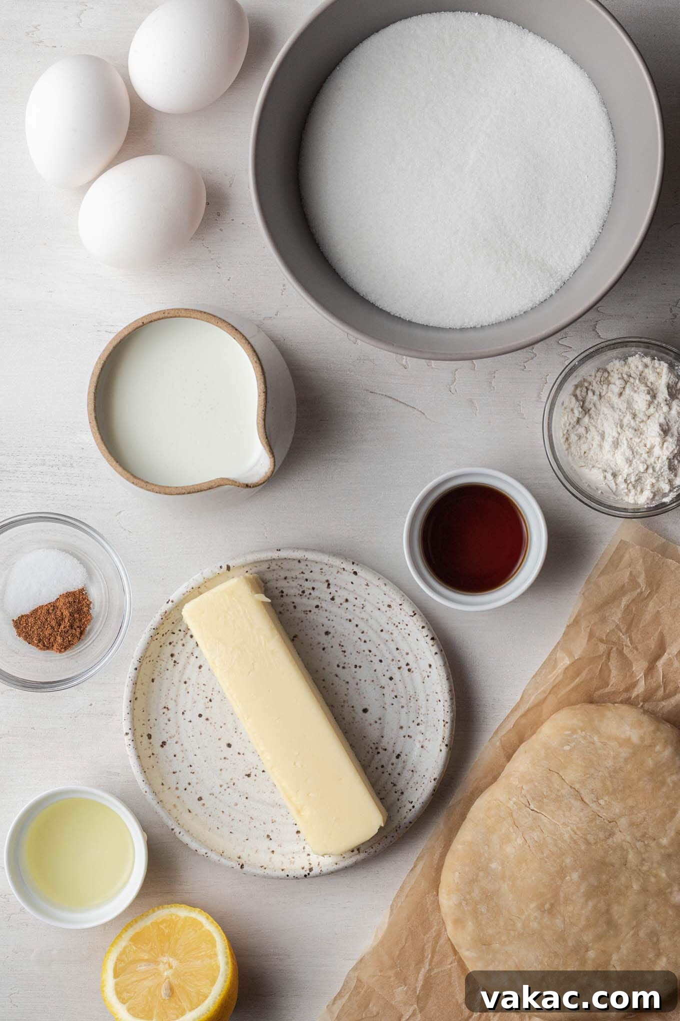 Southern Sunshine Pie 3 Overhead view of the simple, traditional ingredients needed to make Southern buttermilk pie, laid out on a rustic surface.