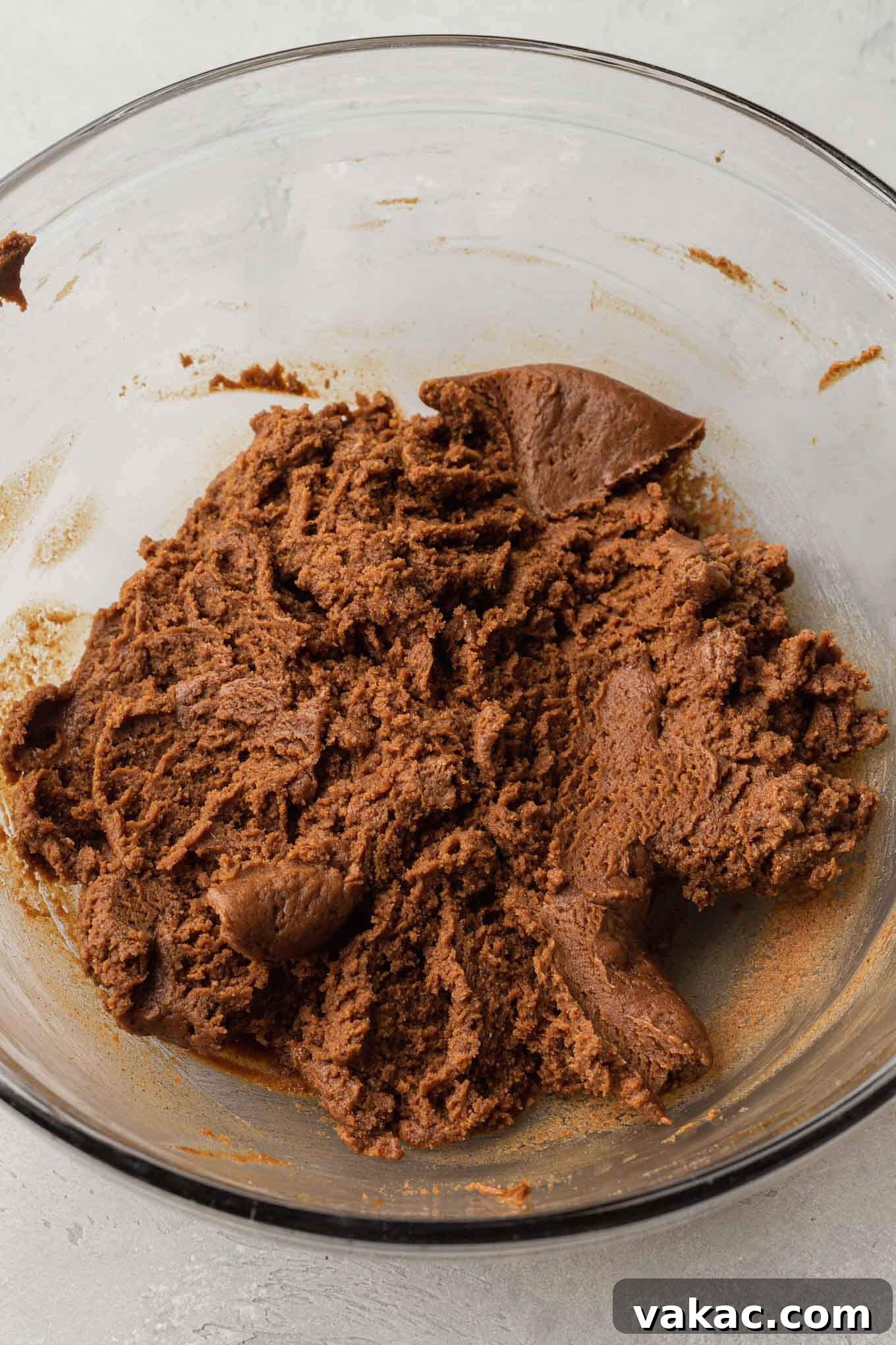 Irresistible Flourless Almond Butter Cookies 4 An overhead view of rich, creamy almond butter cookie dough in a mixing bowl, prior to adding any mix-ins.