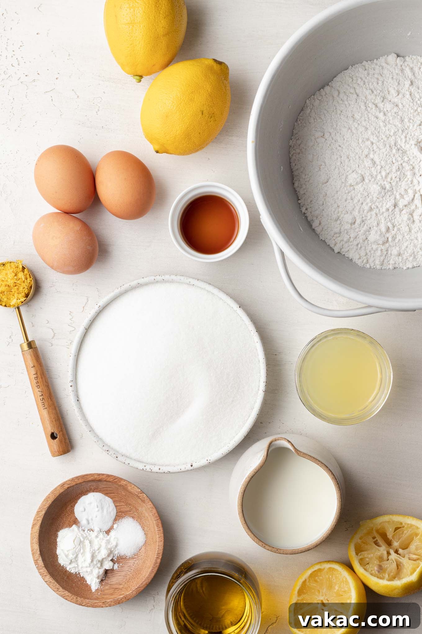 Sunshine Citrus Olive Oil Cake 3 An overhead view of all the fresh, high-quality ingredients meticulously arranged on a countertop, ready to be transformed into a delicious lemon olive oil cake.