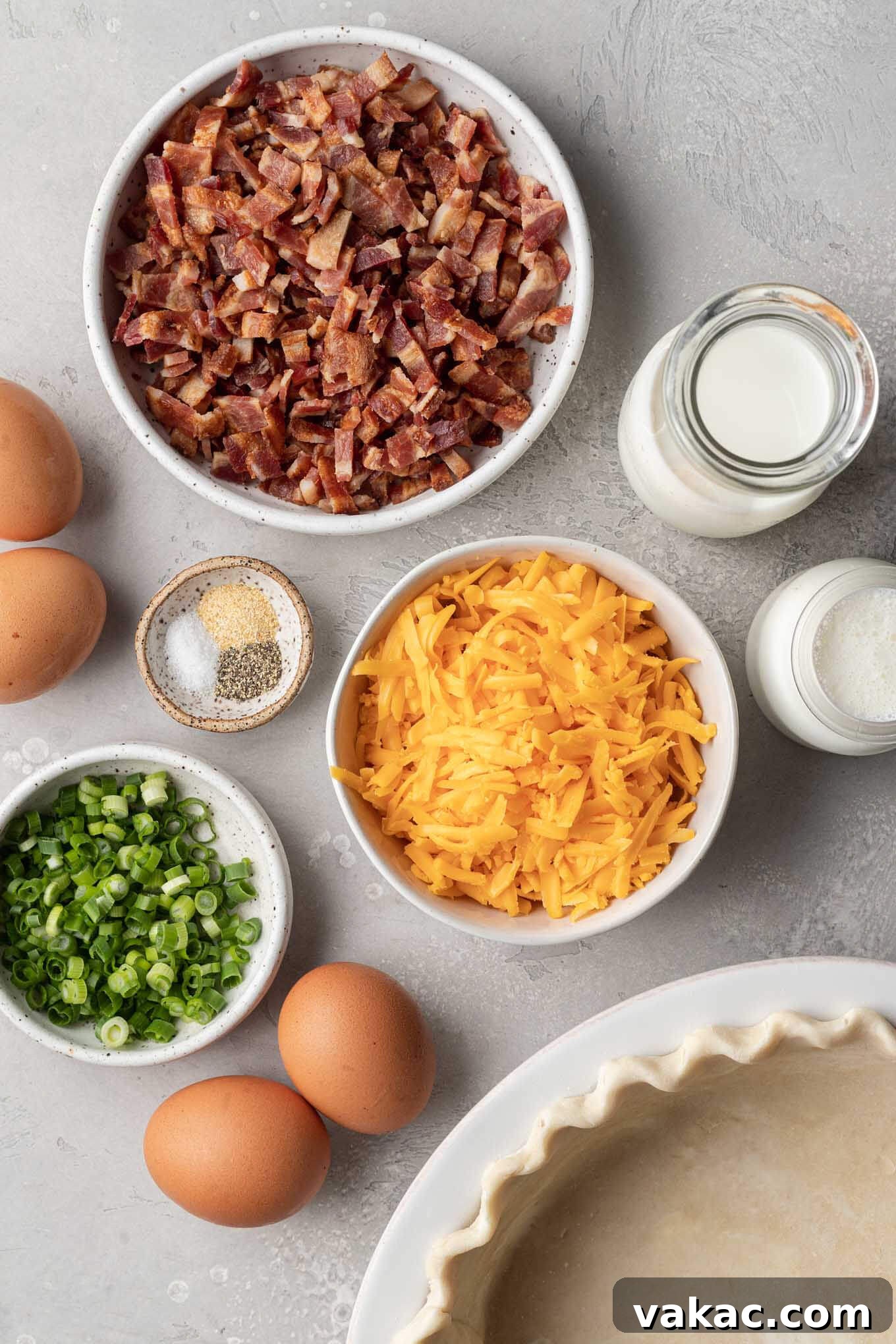 Quiche Made Simple 3 An overhead view of the ingredients needed to make bacon and cheddar quiche.