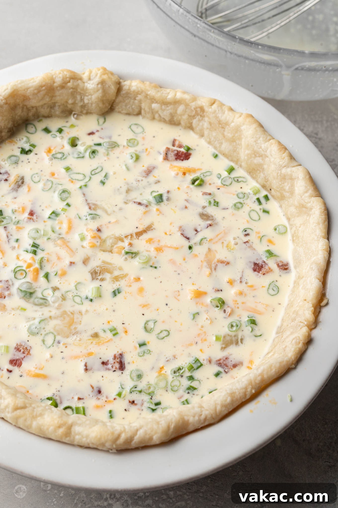 Quiche Made Simple 7 An uncooked quiche, ready to be baked.