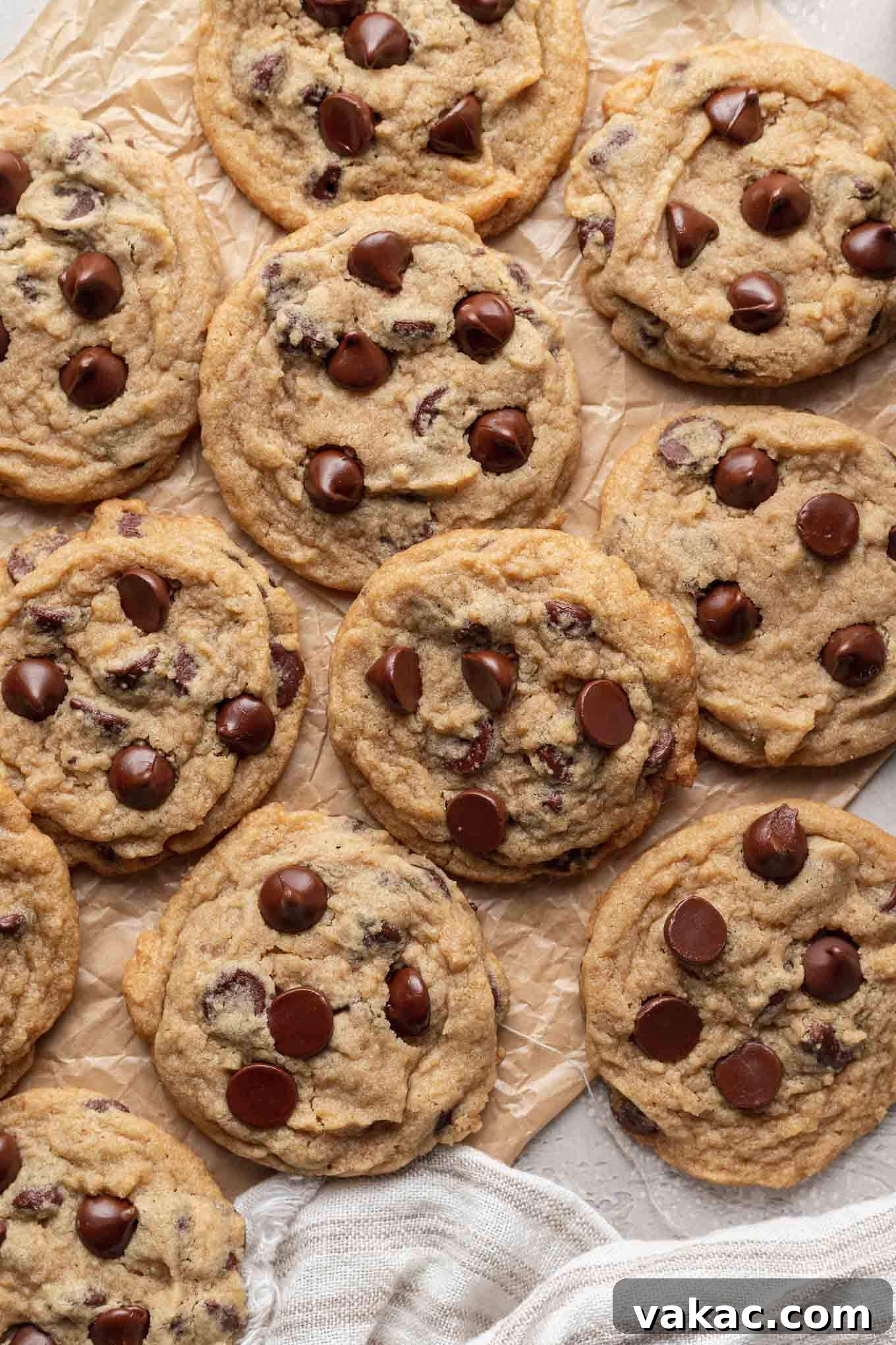 Egg-Free Chocolate Chip Bliss 2 An overhead view of eggless chocolate cookies on parchment paper.