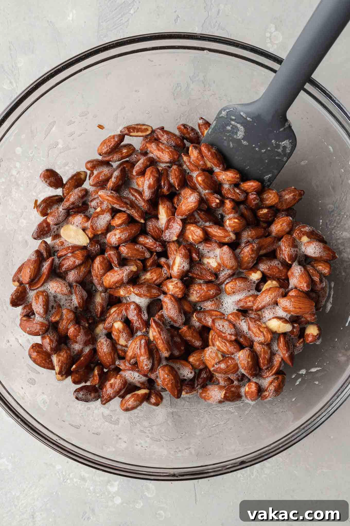 Sugar-Kissed Almonds 4 An overhead view of of raw almonds and egg whites.