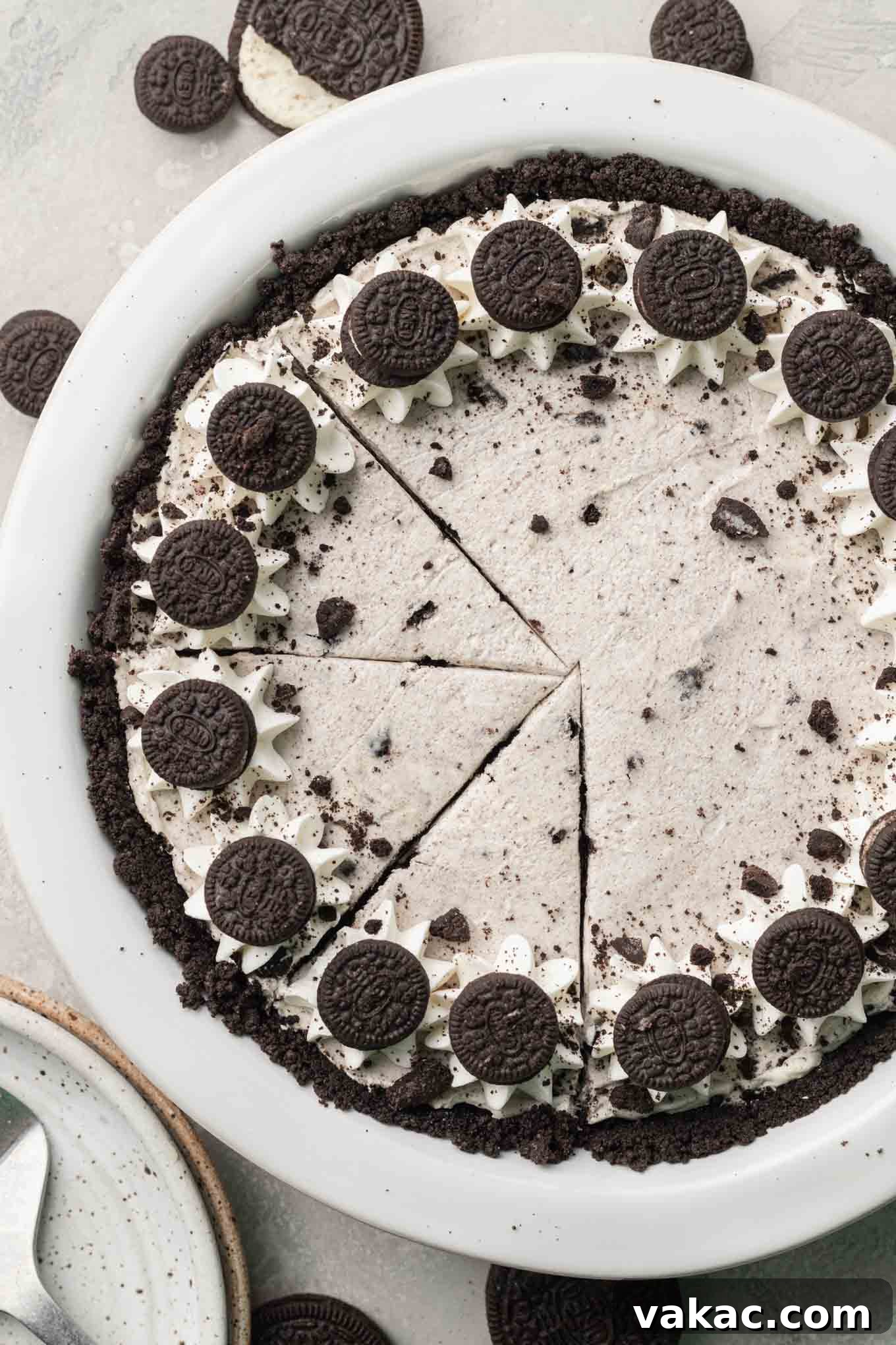 Irresistible Oreo Dream Pie 9 An overhead view of a sliced Oreo pie, showing the dark crust and creamy filling, ready to be served.