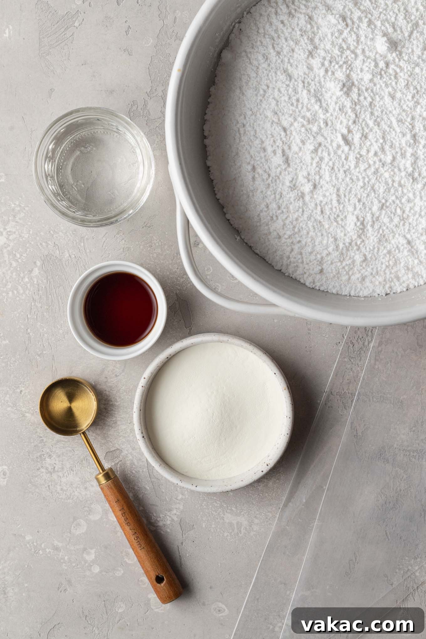 An overhead view of the ingredients needed to make royal icing.