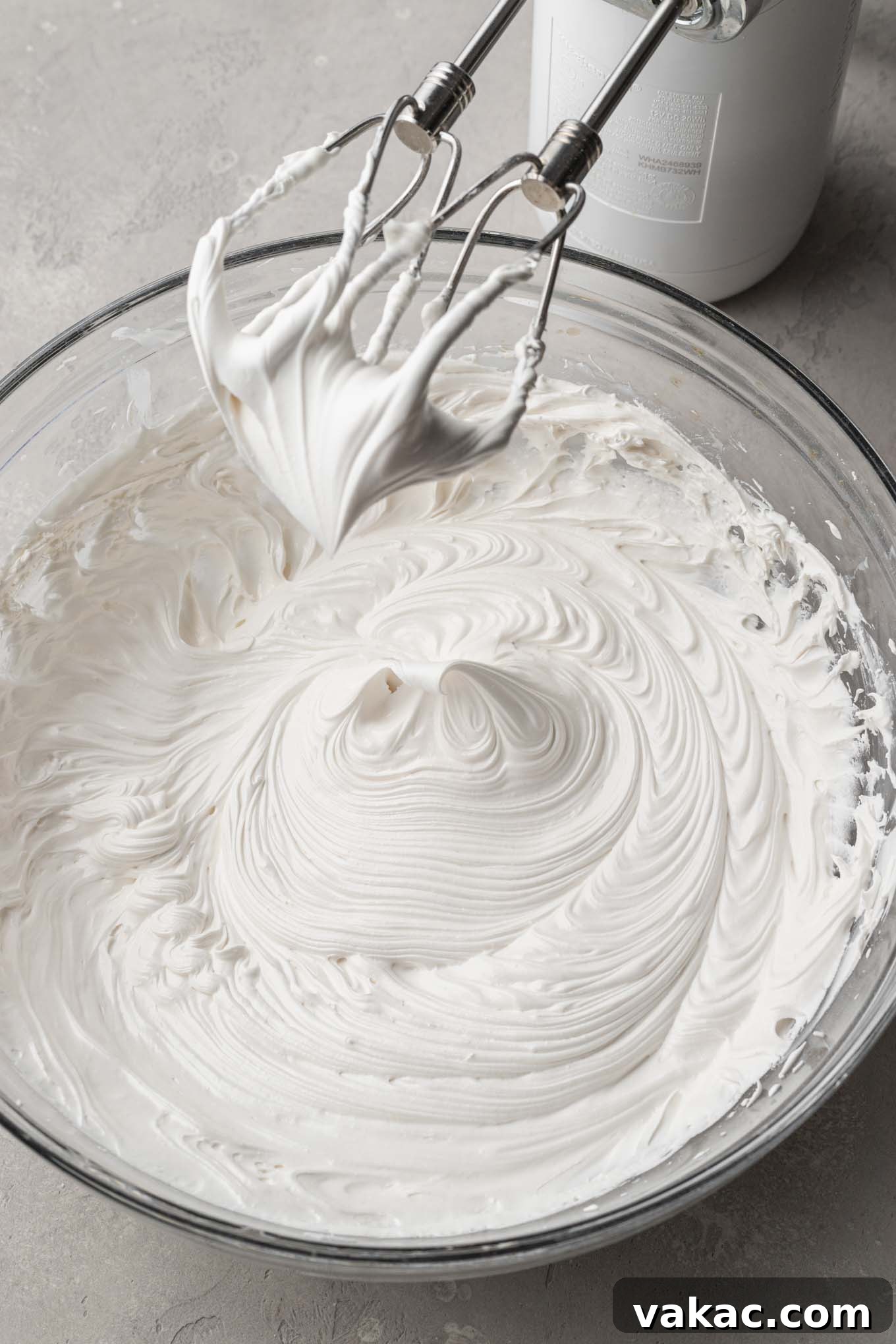 A bowl of royal icing beat to stiff peaks.