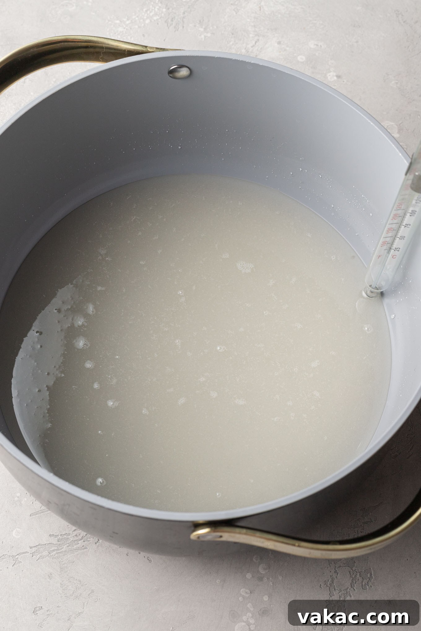 Sweet Peanut Crunch 4 An overhead view of corn syrup and sugar in a saucepan.