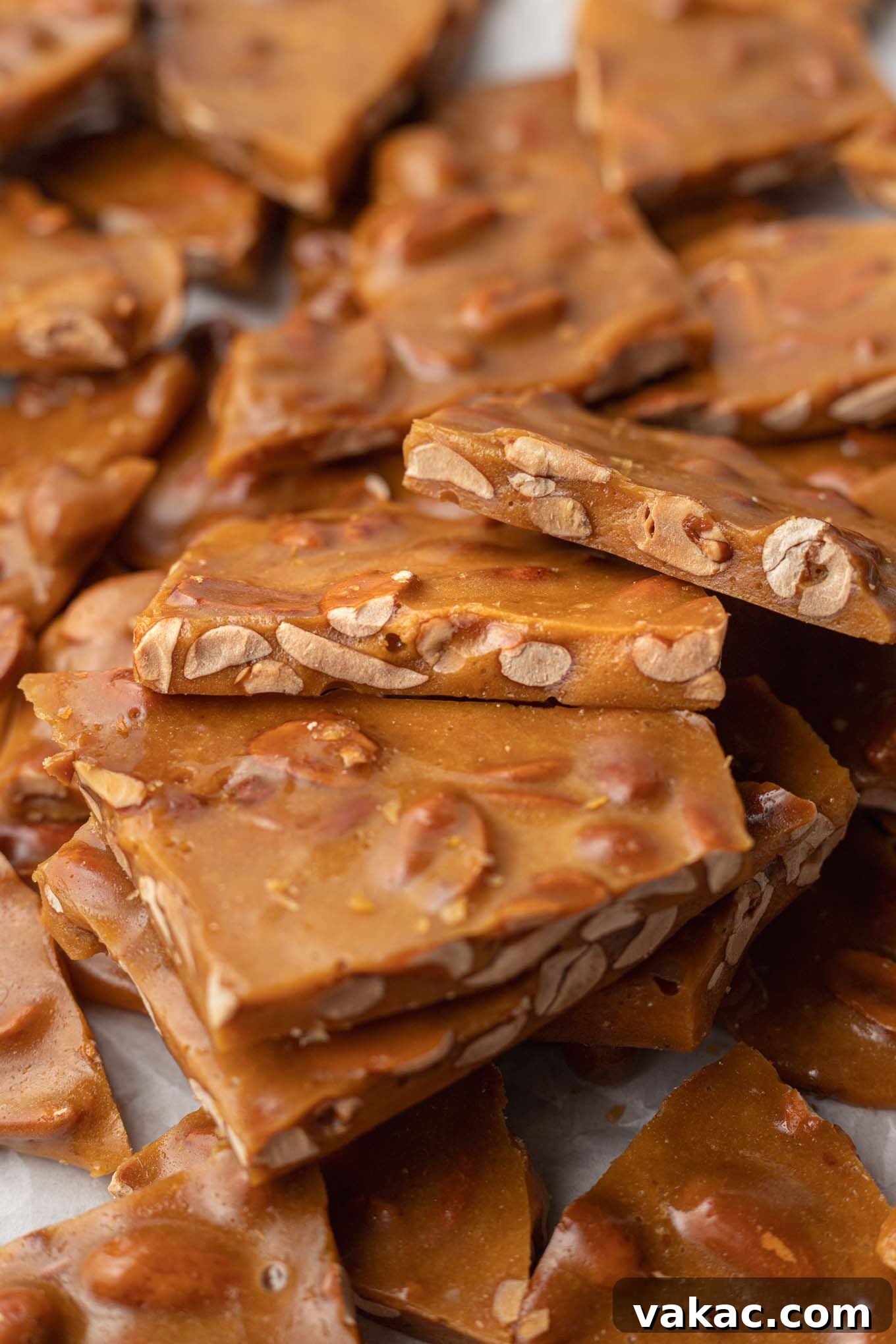 Sweet Peanut Crunch 9 Broken pieces of brittle resting on each other.