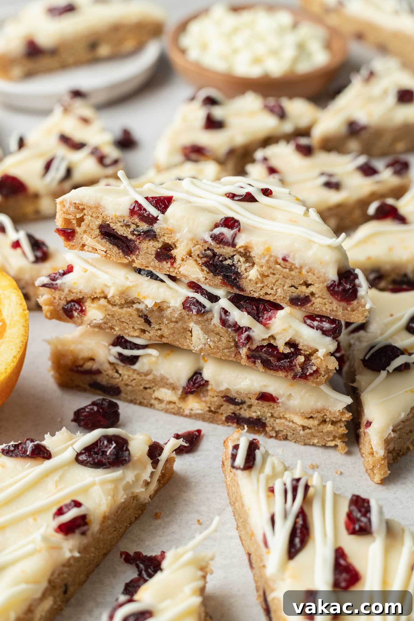 Cranberry Dream Squares 2 A stack of three cranberry bliss bars, surrounded by additional bars.