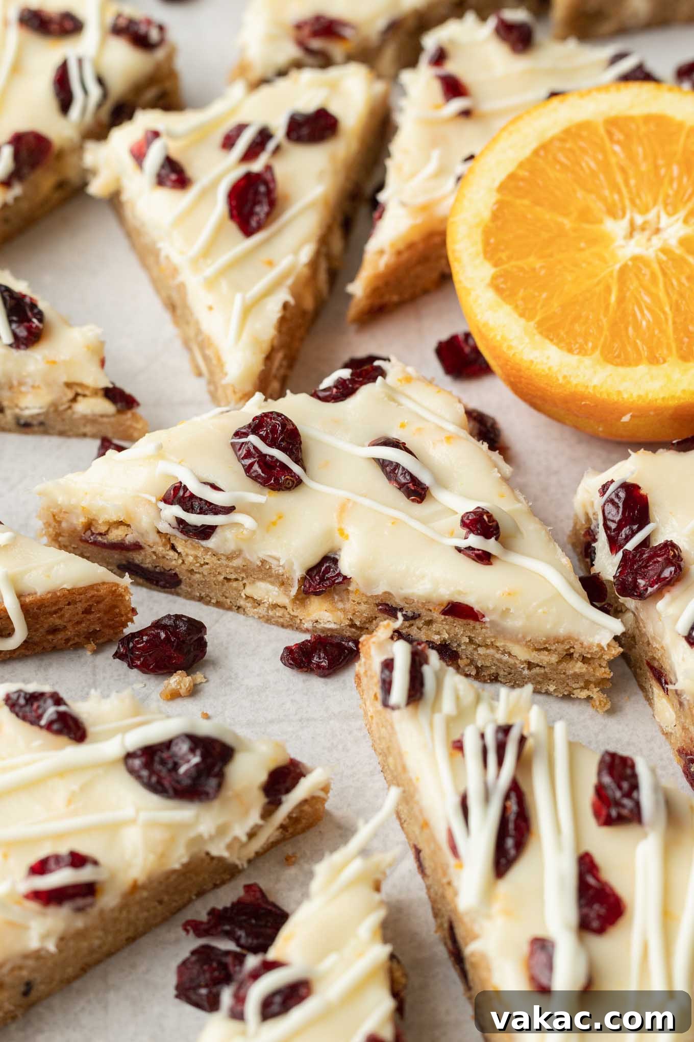 Cranberry Dream Squares 12 Sliced copycat Starbucks cranberry bliss bars on parchment paper.