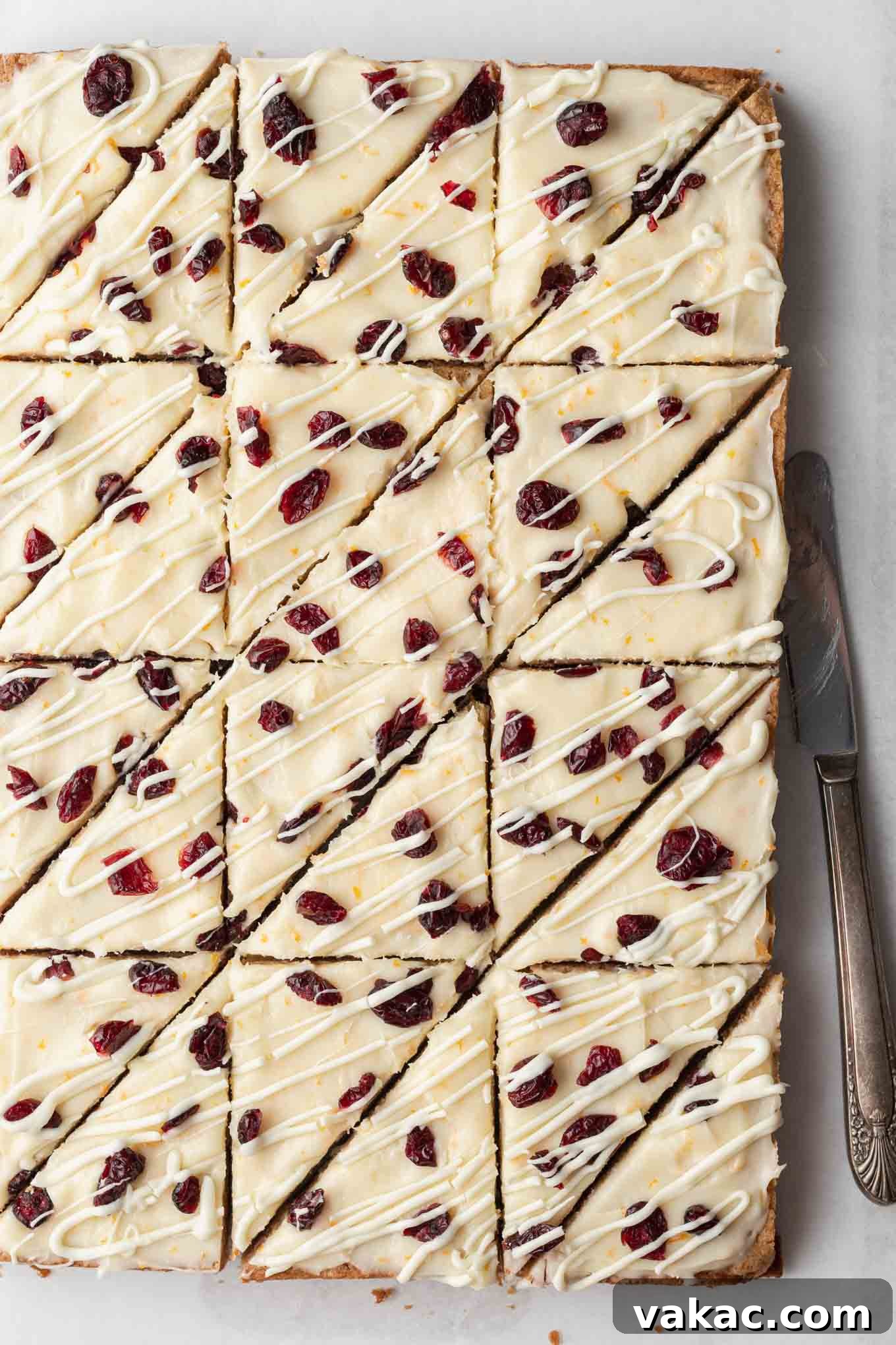 Cranberry Dream Squares 10 An overhead view of copycat cranberry bliss bars, sliced into triangles.