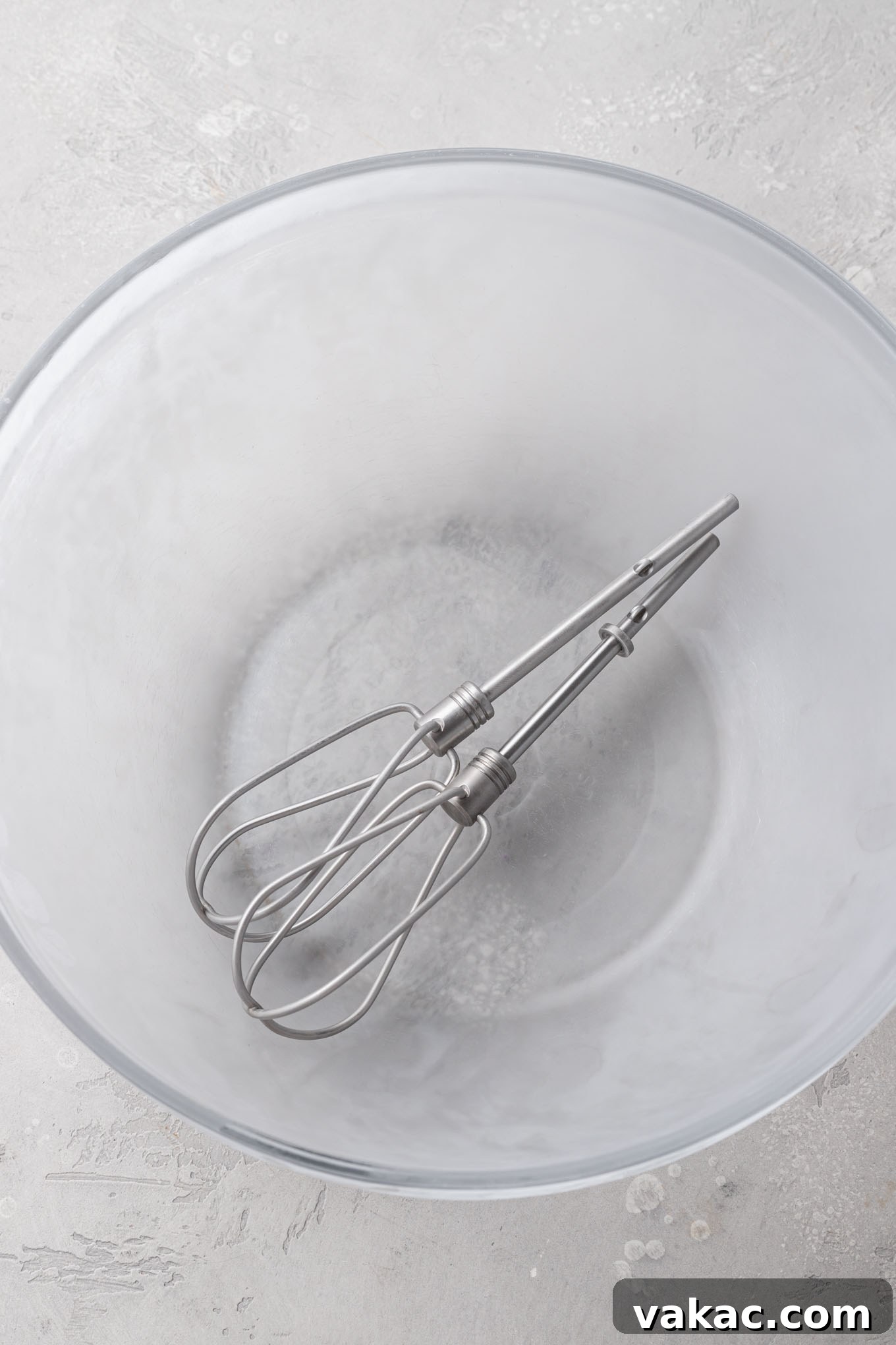 Velvet Chocolate Whip 4 A chilled mixing bowl with the beaters resting inside of it.