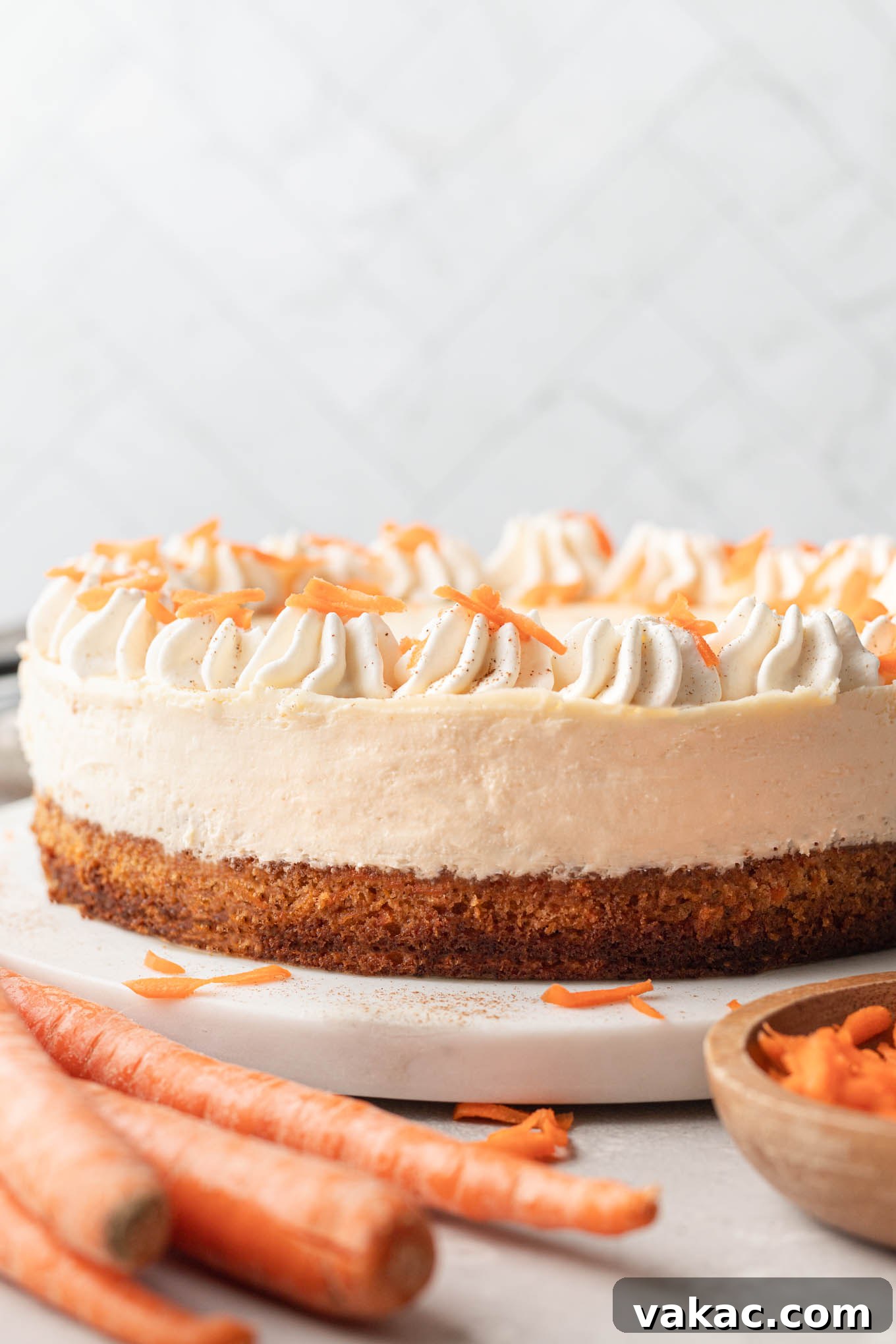 Decadent Spiced Carrot Cheesecake 2 A side view of a layered carrot cake cheesecake.