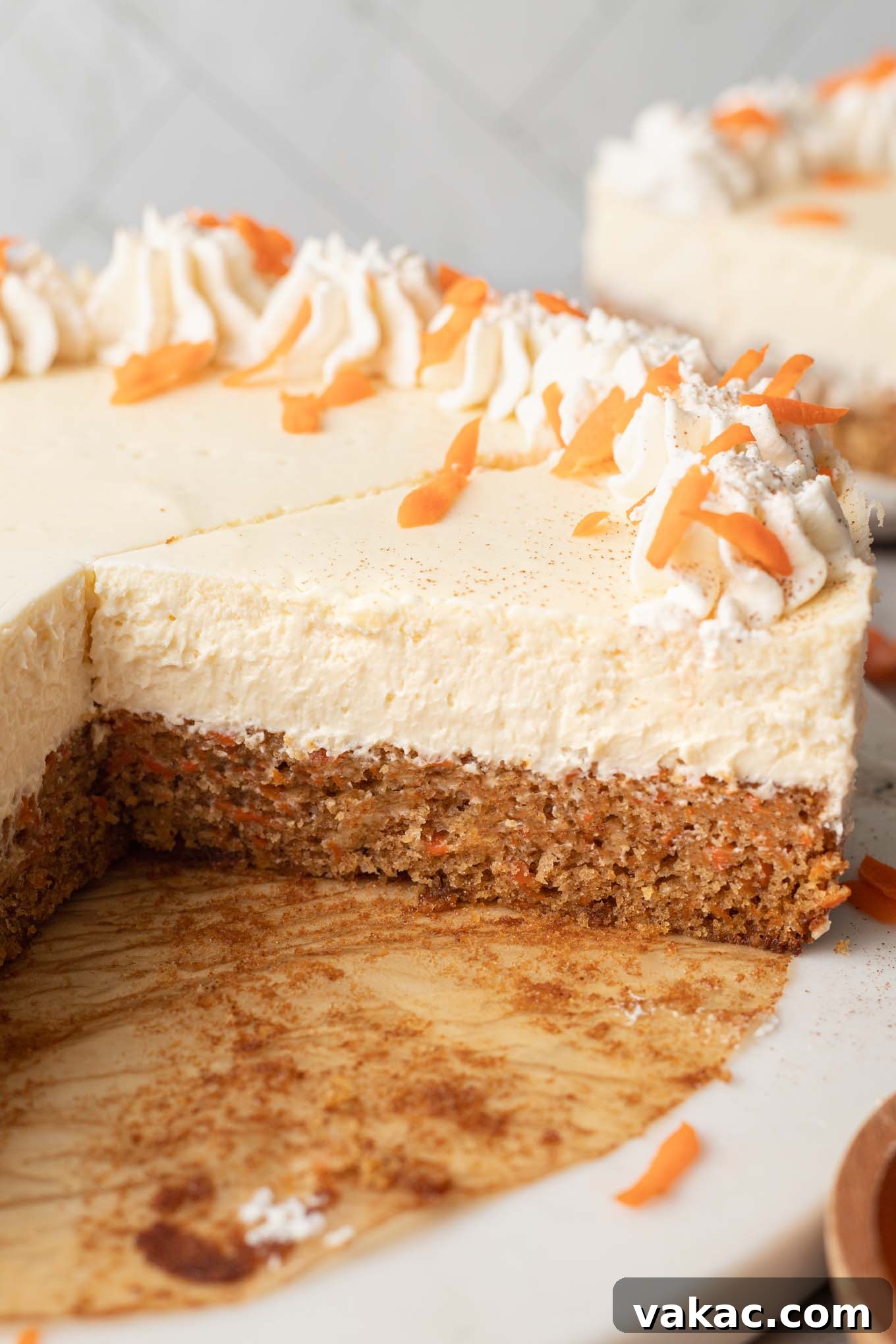 Decadent Spiced Carrot Cheesecake 10 A side view of a sliced carrot cake cheesecake.